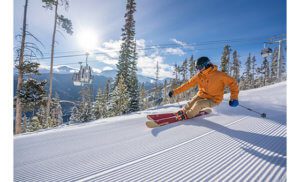 Skiing Hughes under sunny bluebird skies